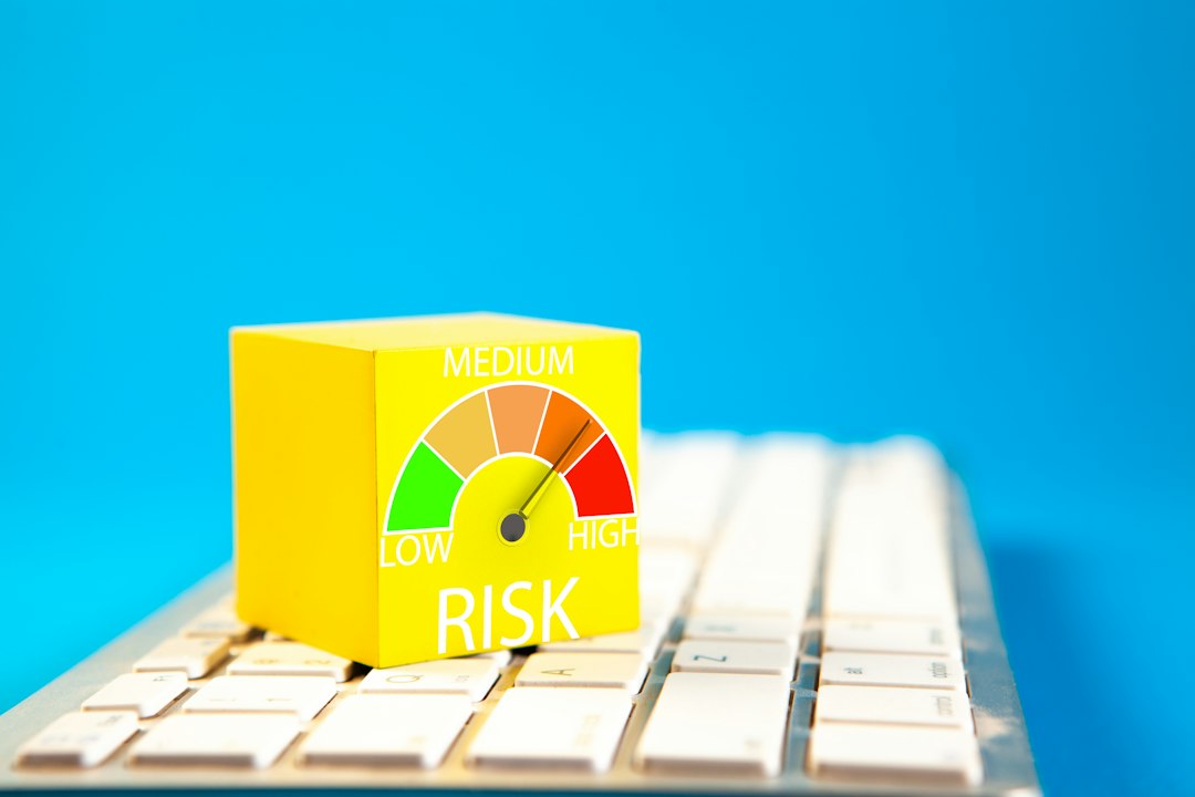 Risk dial on a keyboard, illustrating stress testing a bank portfolio against severe scenarios